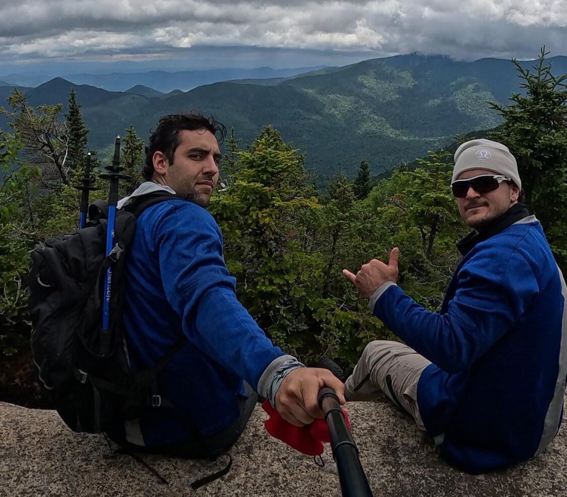 A photo of the hiking guides at The Adirondack Tool Co. - Hiking Plans, Guides, and Gear on the summit of Upper Wolfjaw Mountain in the Adirondack Mountains of New York.
